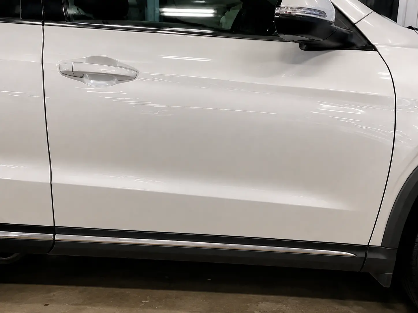Pearl-white SUV door restored after repair